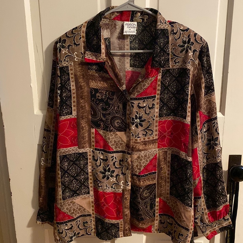 Womens multi colored blouse with cuffed sleeves.